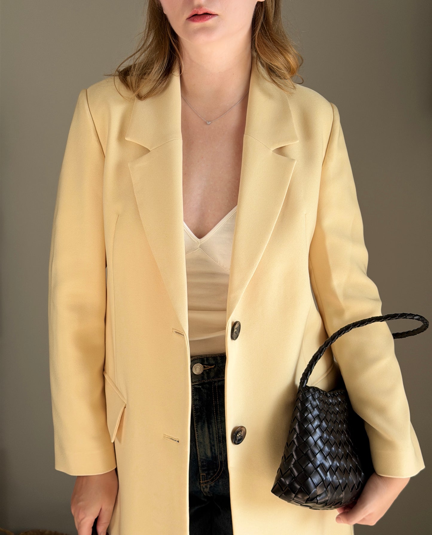 Stylish pale yellow long trench coat