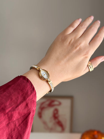 Charming vintage gold-tone watch with crystals