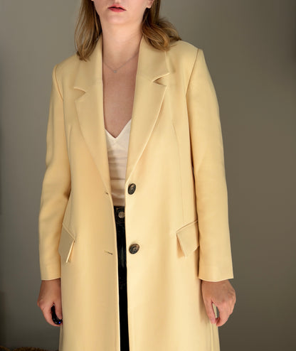 Stylish pale yellow long trench coat