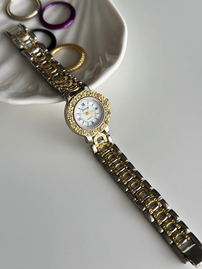 Stunning vintage two-tone watch with five interchangeable bezels