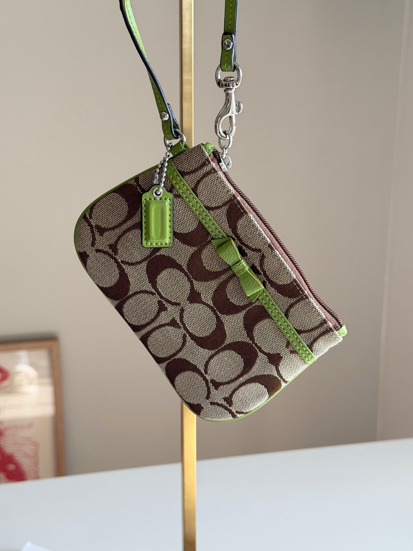 Vintage Coach wristlet with lime green bow