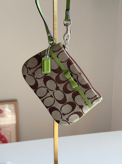 Vintage Coach wristlet with lime green bow