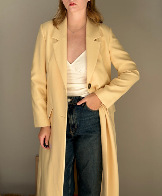 Stylish pale yellow long trench coat
