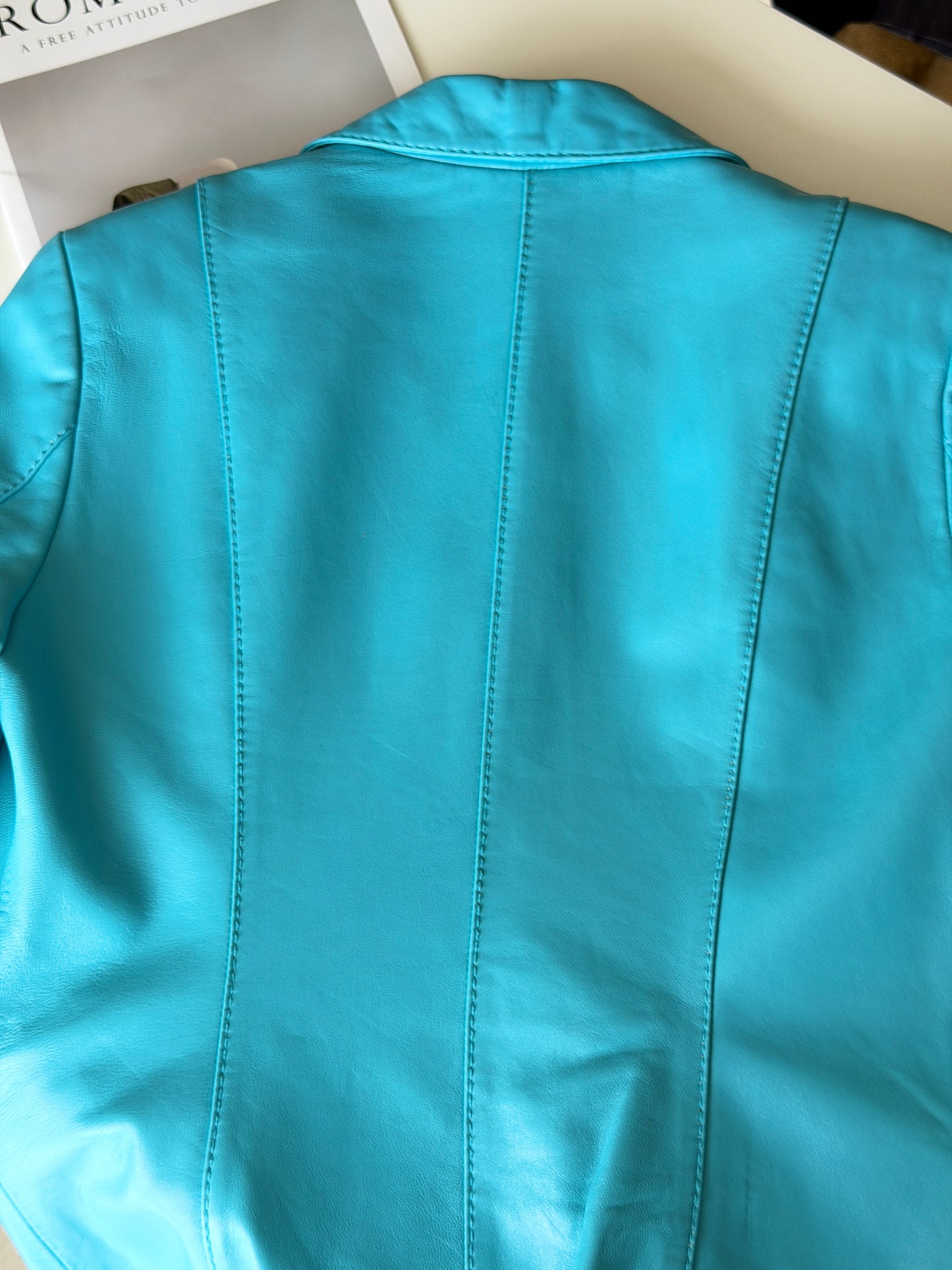 Vintage leather jacket in striking turquoise shade