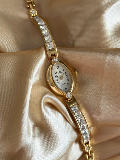 Charming vintage gold-tone watch with crystals