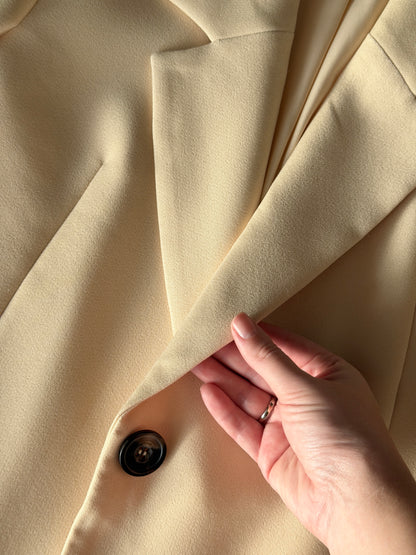 Stylish pale yellow long trench coat