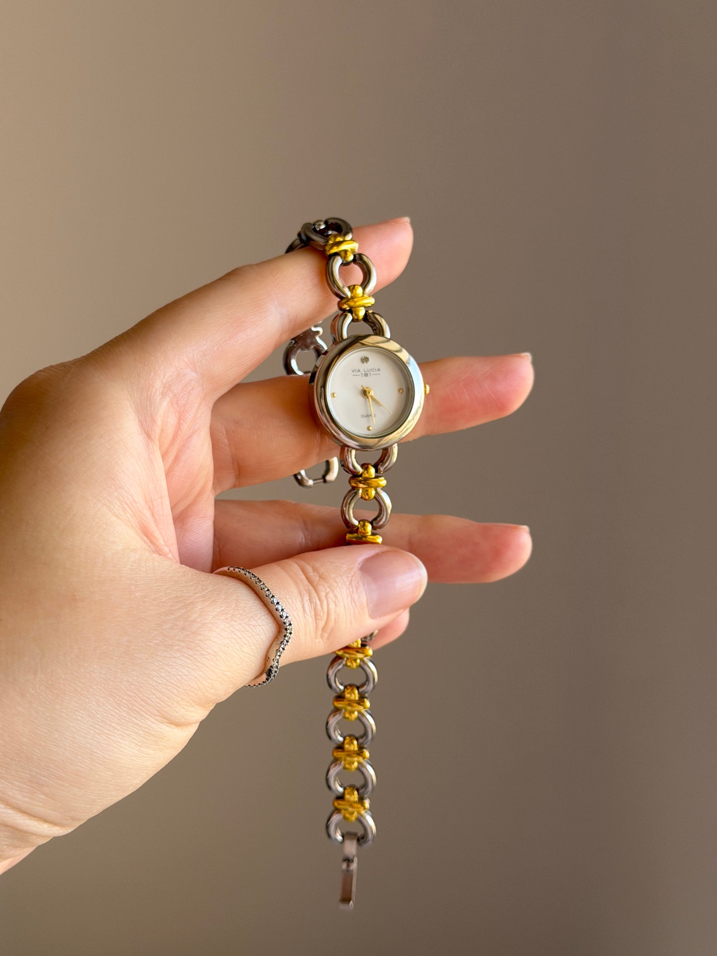 Vintage two-tone watch with a delicate round dial