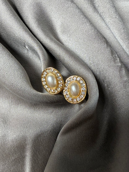 Classic vintage stud earrings featuring a faux pearl