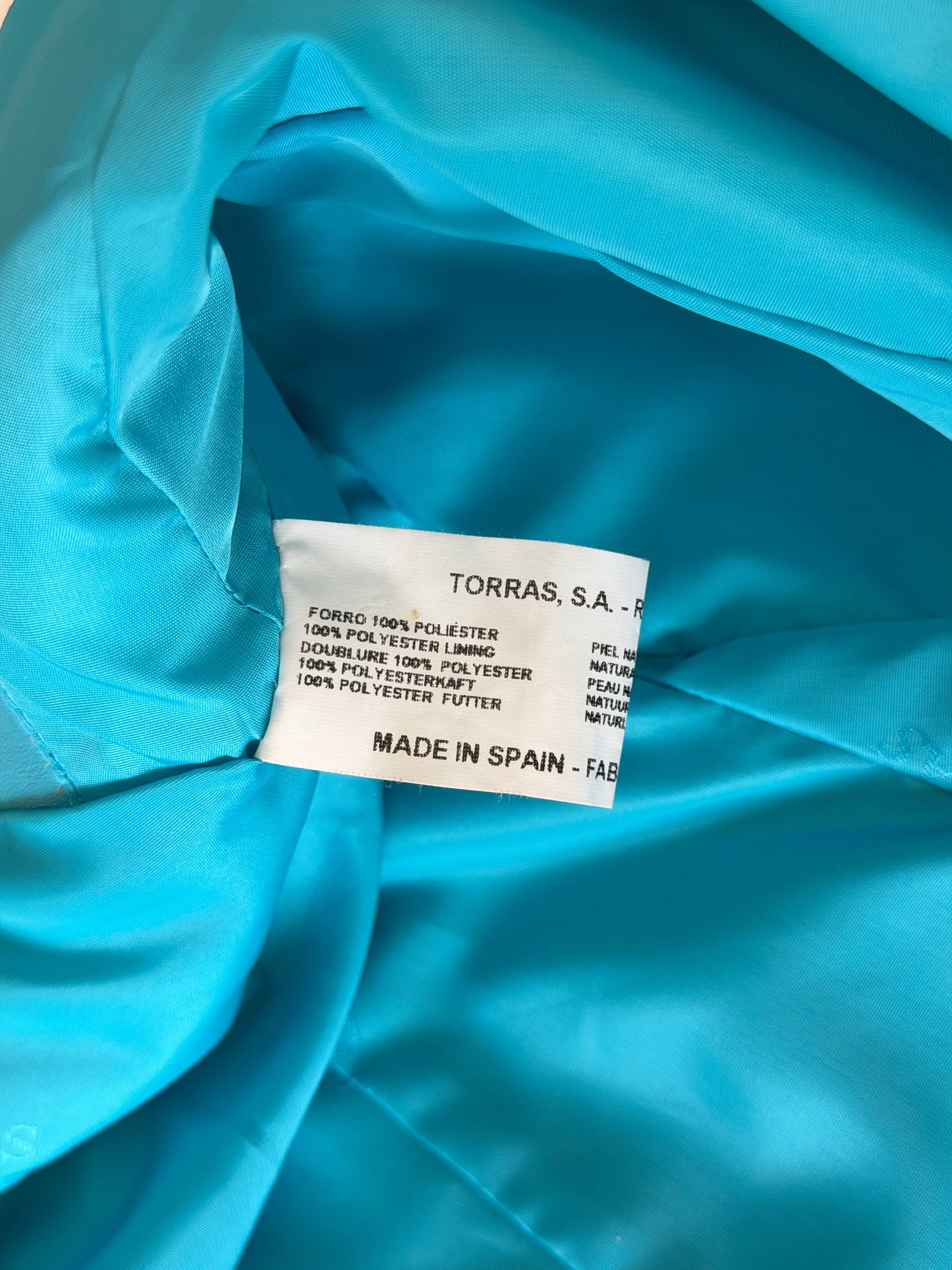 Vintage leather jacket in striking turquoise shade