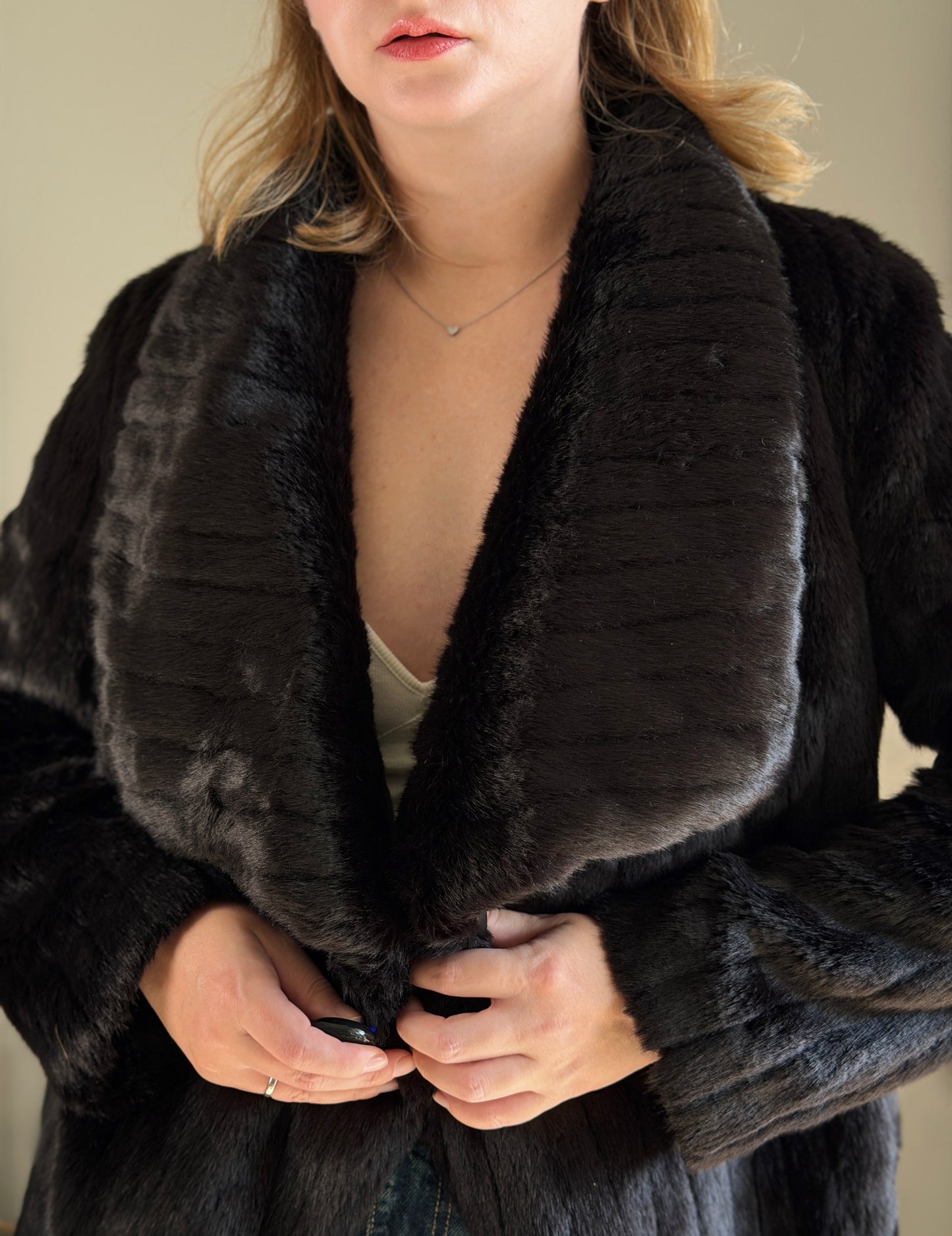 Stunning black faux fur coat with a dramatic look