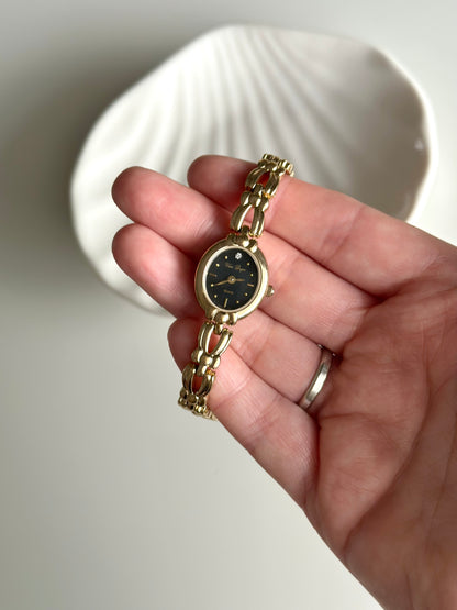 Incredible vintage gold-tone watch with black dial (1990s)