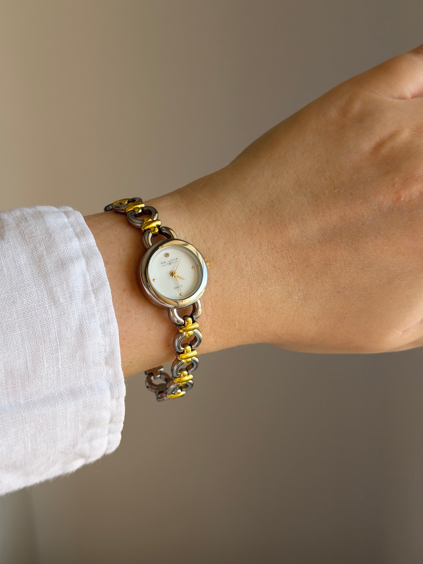 Vintage two-tone watch with a delicate round dial