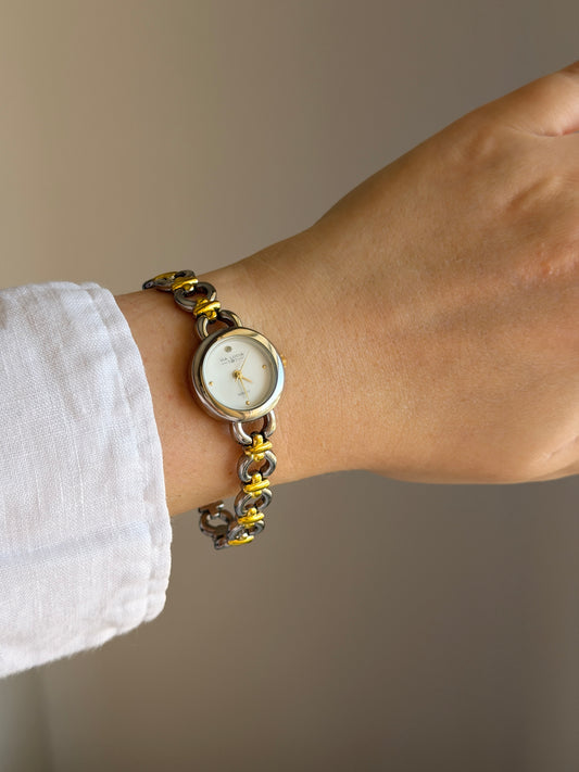 Vintage two-tone watch with a delicate round dial