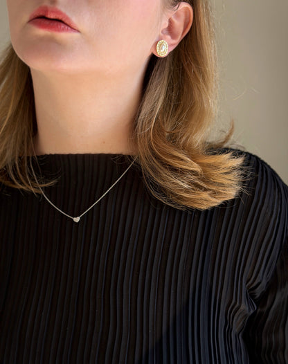 Classic vintage stud earrings featuring a faux pearl