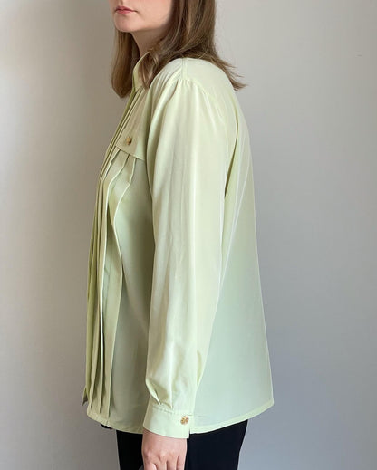 Beautiful vintage blouse in a pastel light green colour