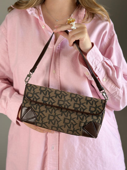 Chic vintage DKNY baguette bag with a rich brown monogram pattern