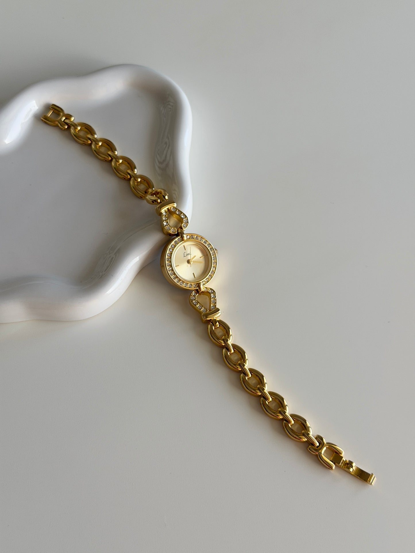 Amazing gold-tone watch Limit with rhinestones