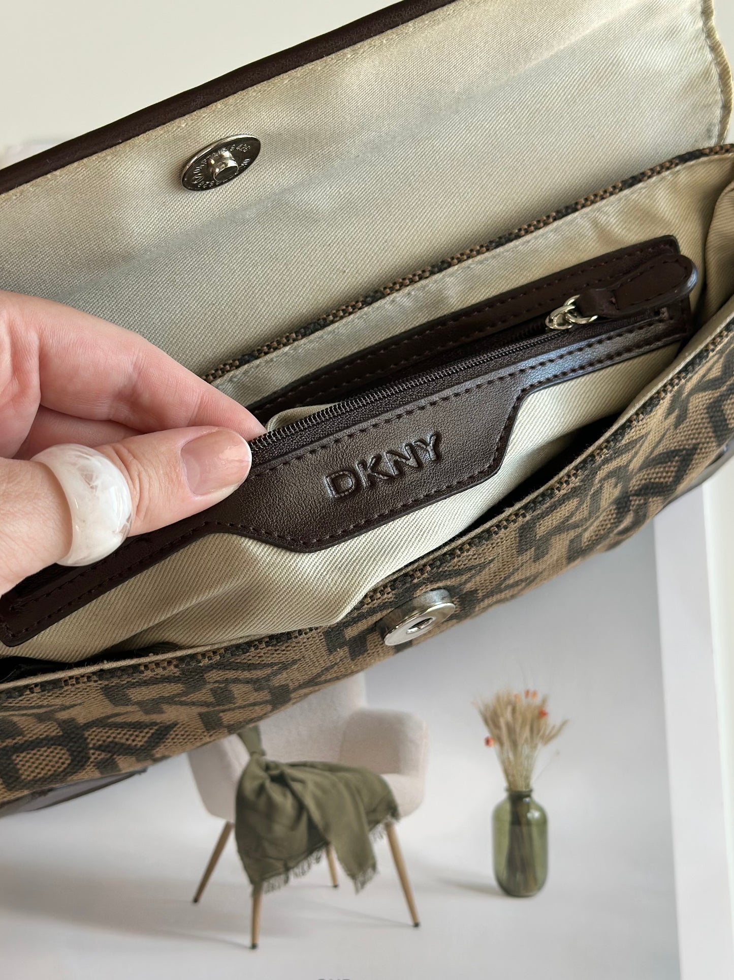 Chic vintage DKNY baguette bag with a rich brown monogram pattern