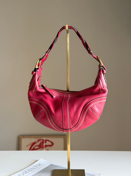 Iconic vintage Coach Soho bag in vibrant fuchsia leather