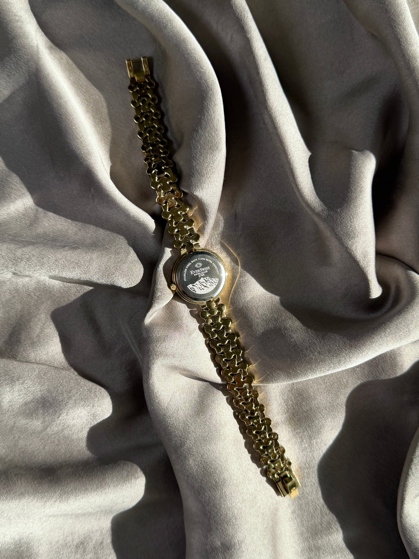 Elegant vintage gold-tone watch EverSwiss with black dial