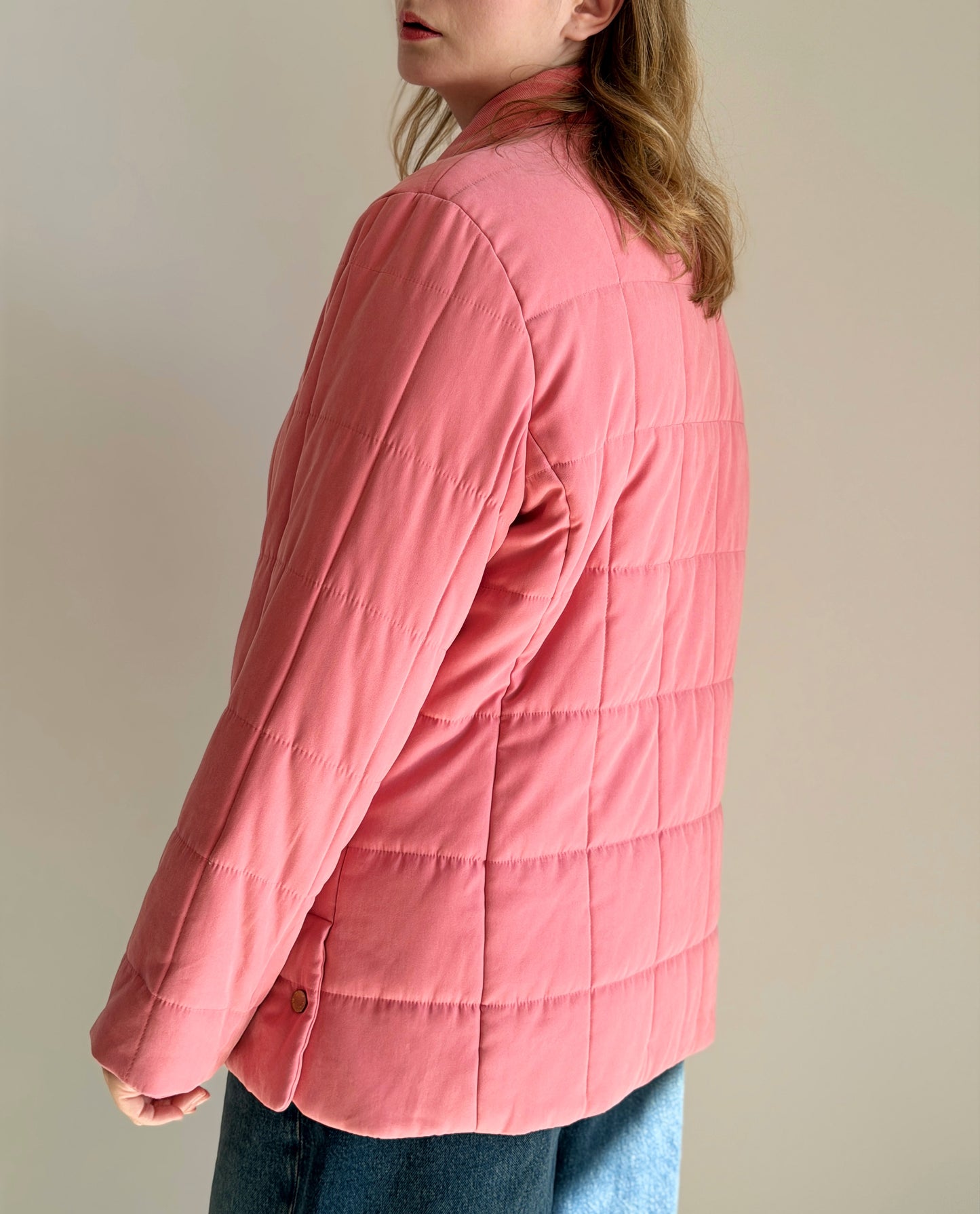 Charming quilted jacket in a soft coral pink shade