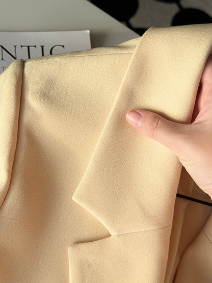 Stylish pale yellow long trench coat