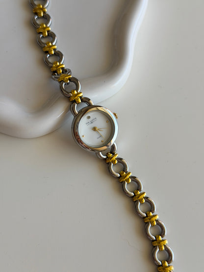Vintage two-tone watch with a delicate round dial