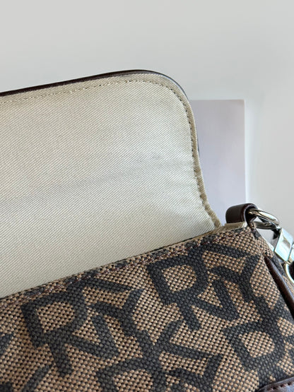 Chic vintage DKNY baguette bag with a rich brown monogram pattern