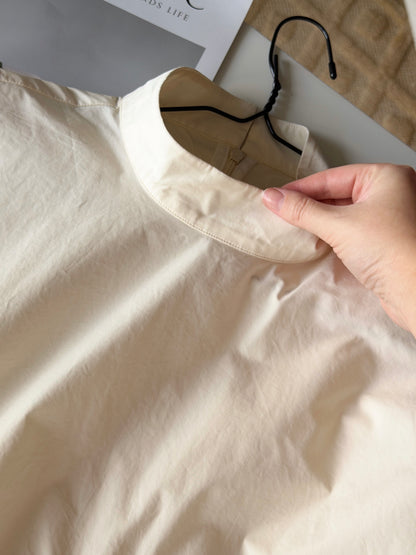 Minimalist cotton top in a soft cream shade