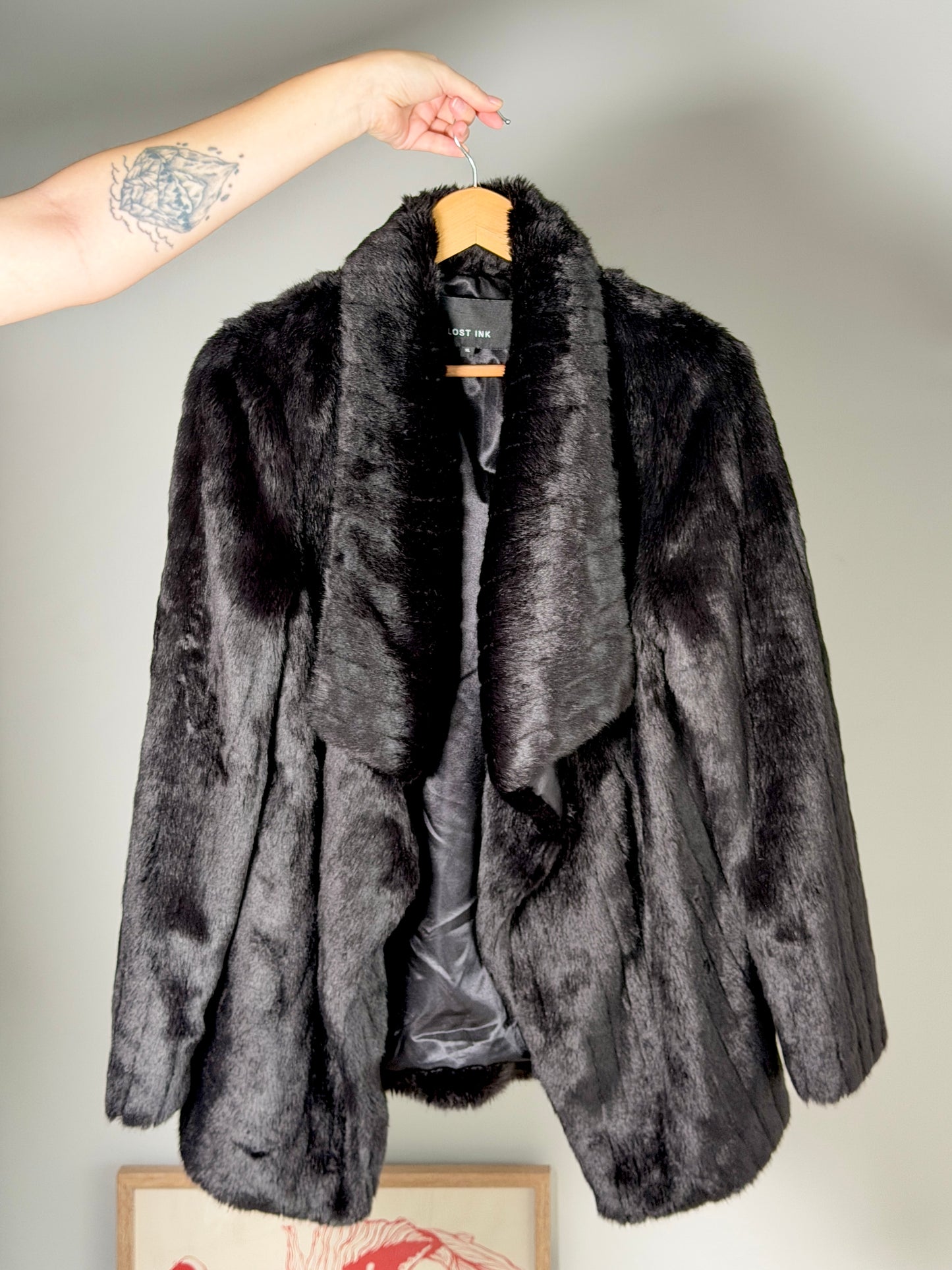 Stunning black faux fur coat with a dramatic look