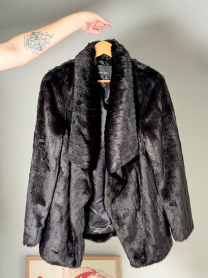 Stunning black faux fur coat with a dramatic look