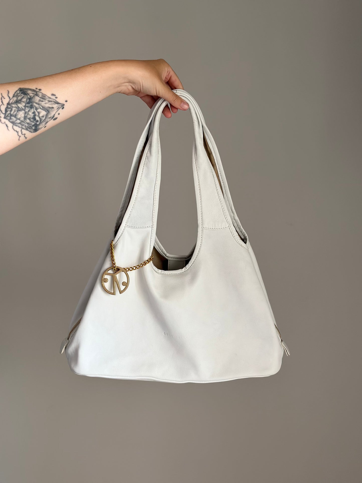 Stylish Coccinelle bag in soft white leather