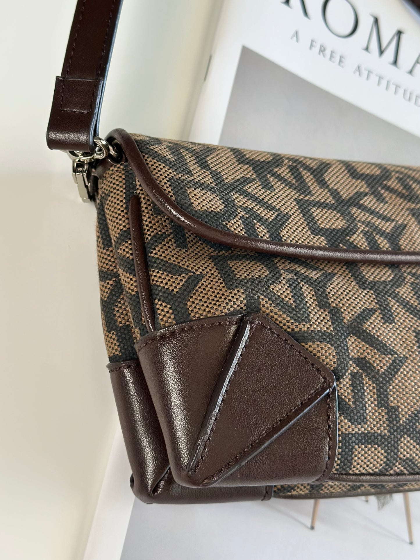 Chic vintage DKNY baguette bag with a rich brown monogram pattern