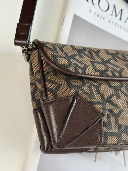 Chic vintage DKNY baguette bag with a rich brown monogram pattern