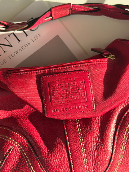 Iconic vintage Coach Soho bag in vibrant fuchsia leather