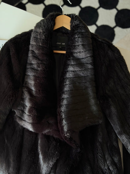 Stunning black faux fur coat with a dramatic look