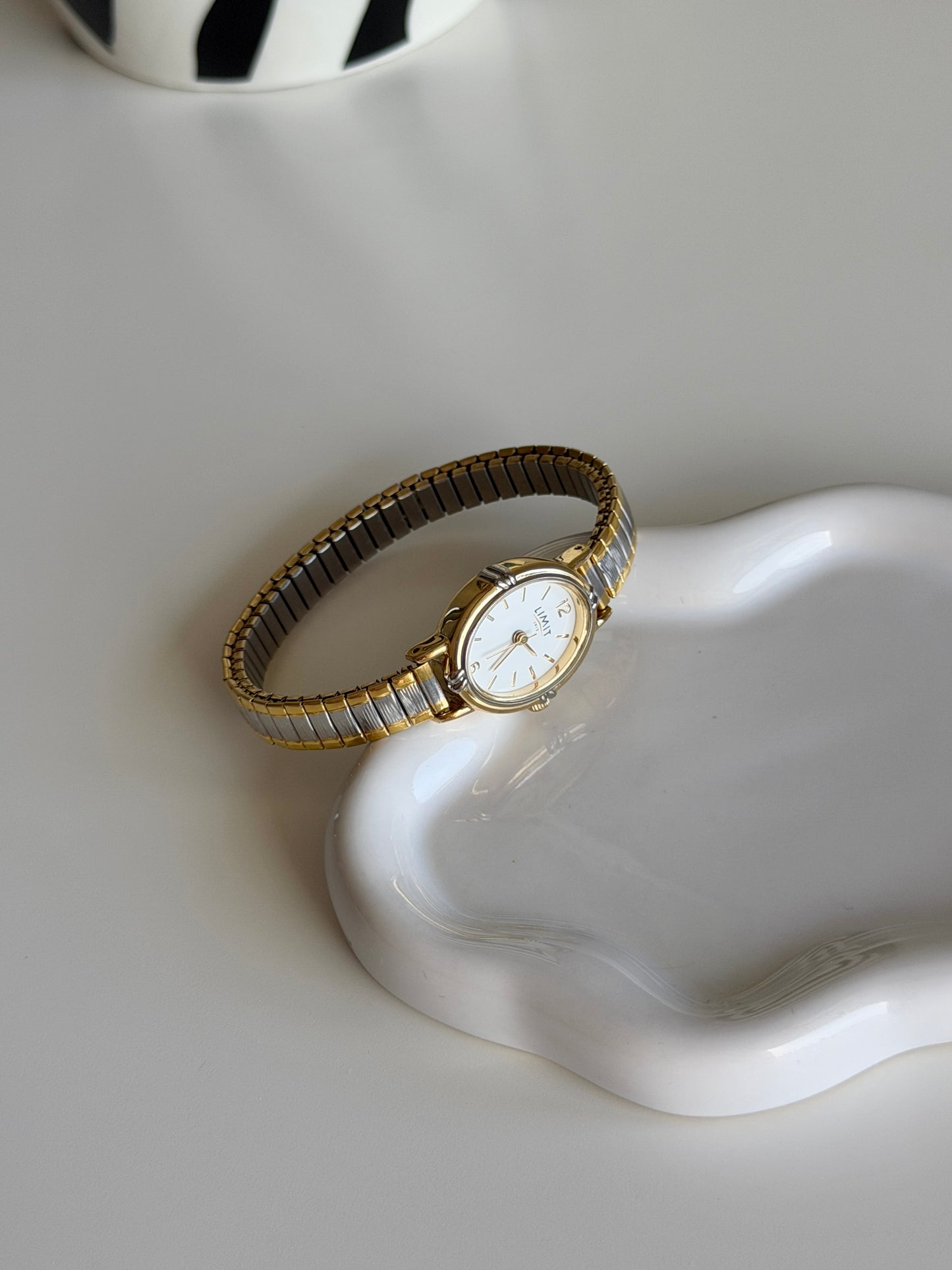Lovely two-tone Limit watch with engraving on the case back