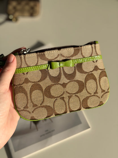 Vintage Coach wristlet with lime green bow