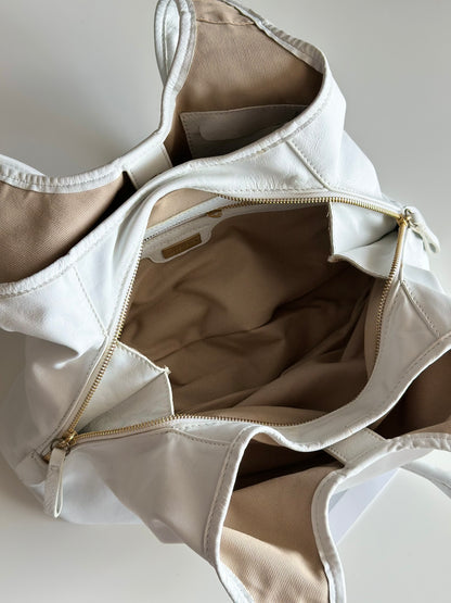 Stylish Coccinelle bag in soft white leather