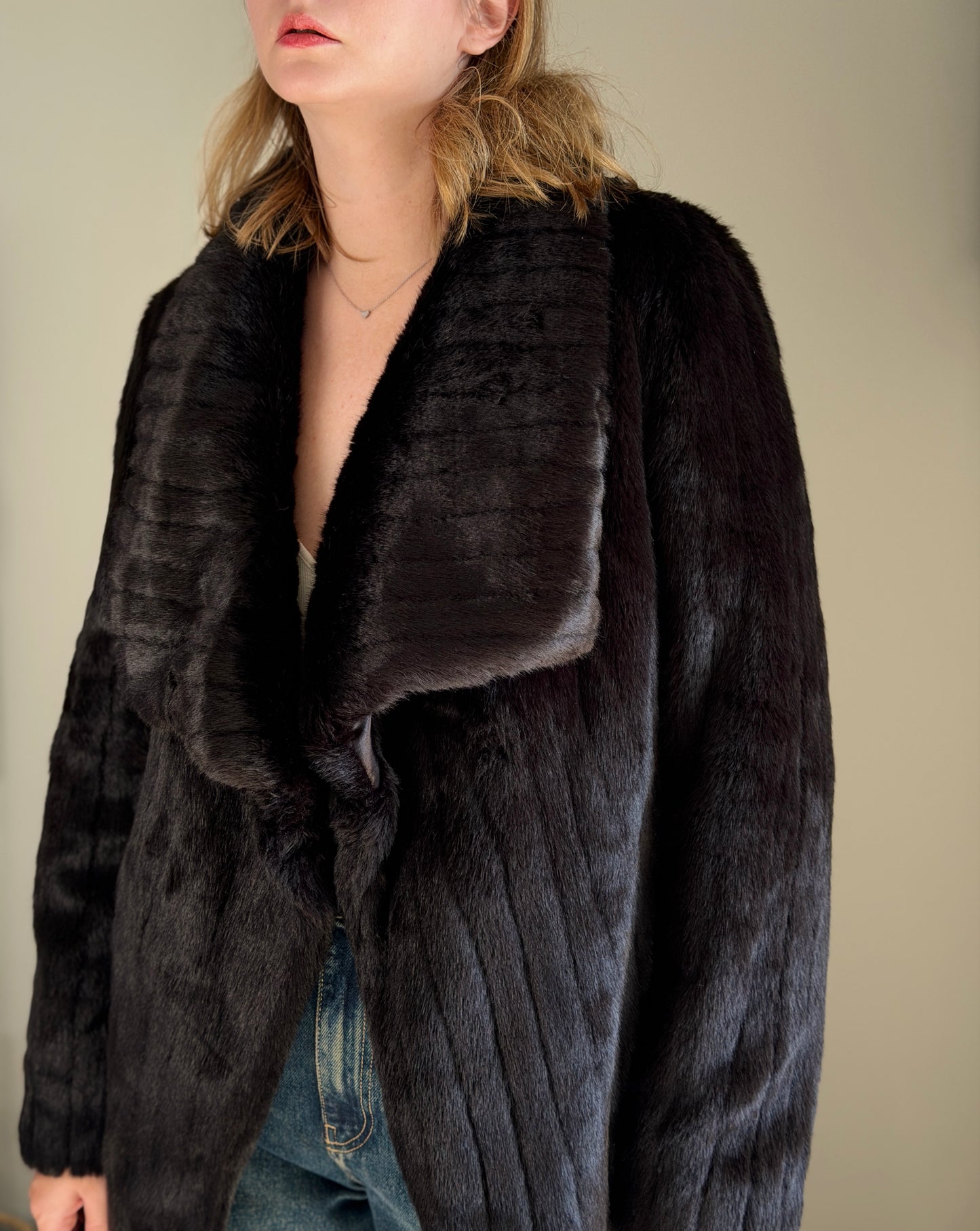 Stunning black faux fur coat with a dramatic look