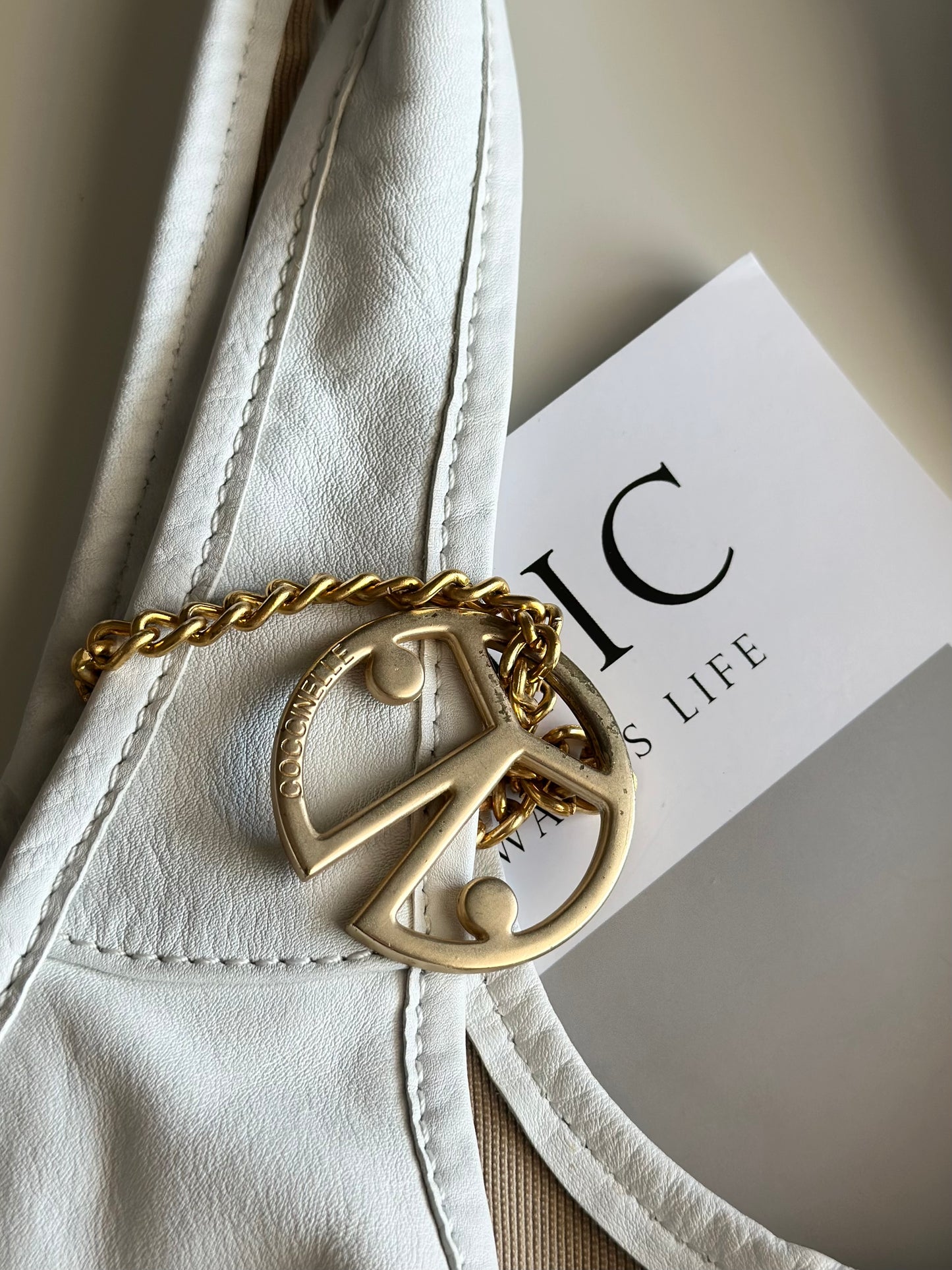 Stylish Coccinelle bag in soft white leather