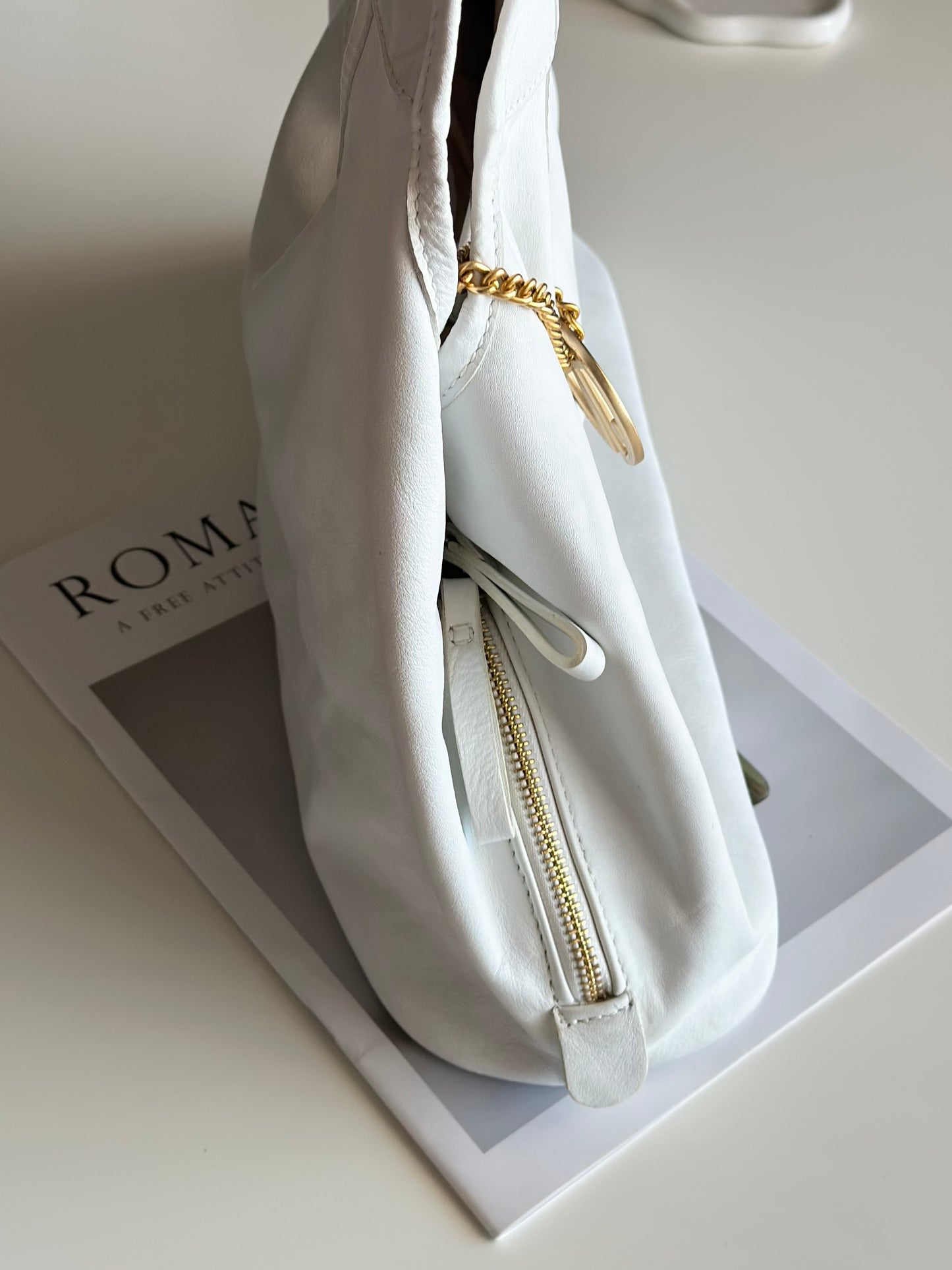 Stylish Coccinelle bag in soft white leather