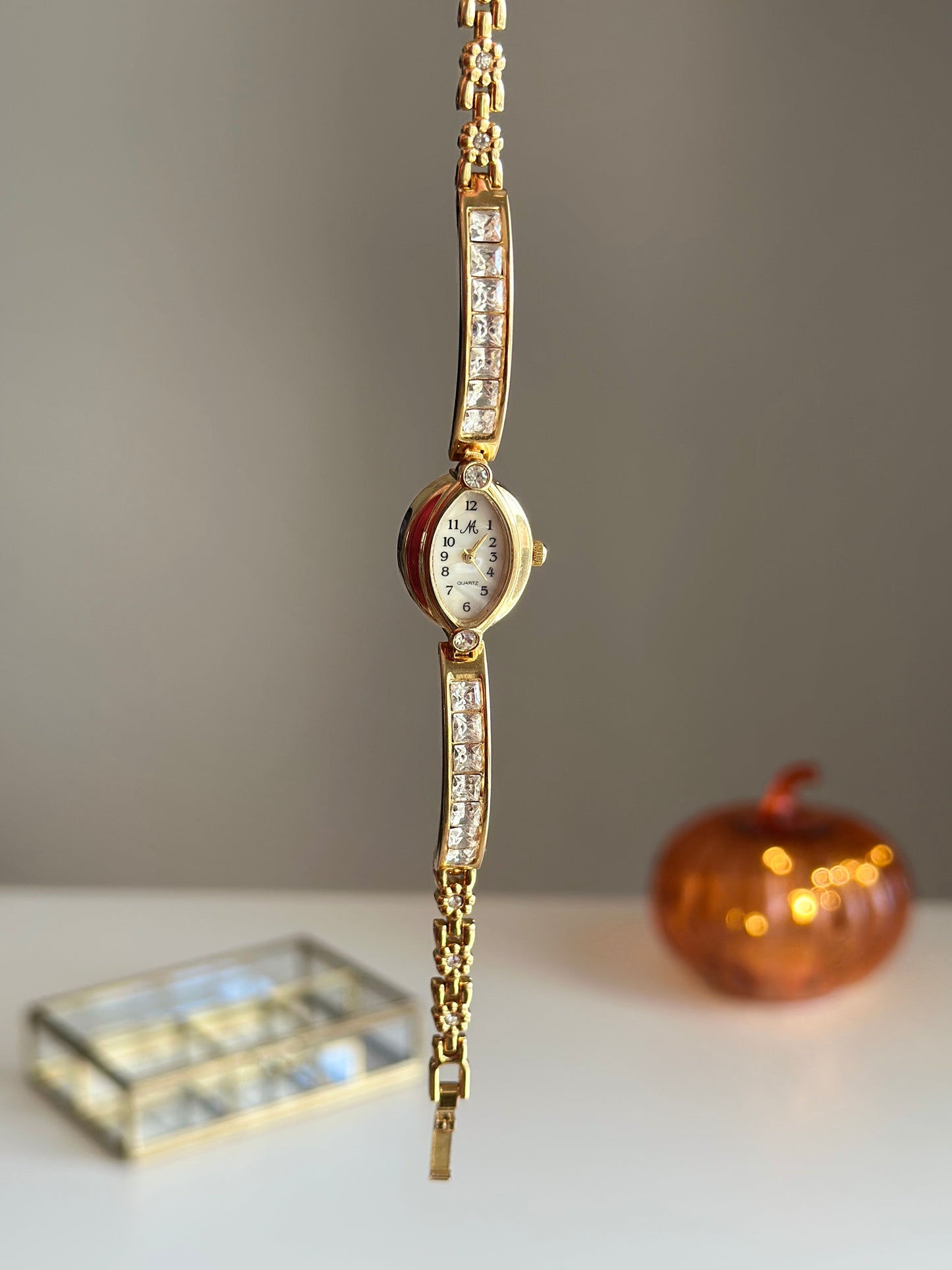 Charming vintage gold-tone watch with crystals