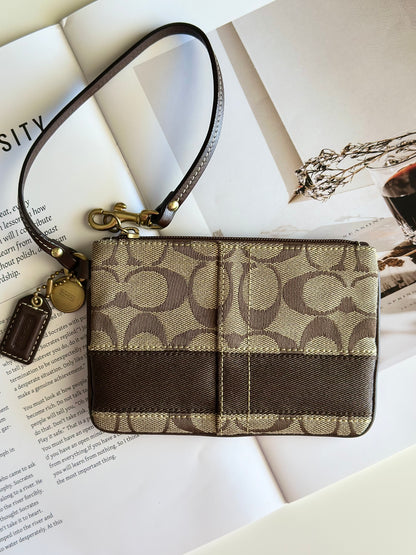 Iconic vintage brown Coach wristlet