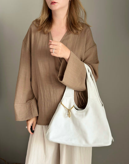 Stylish Coccinelle bag in soft white leather