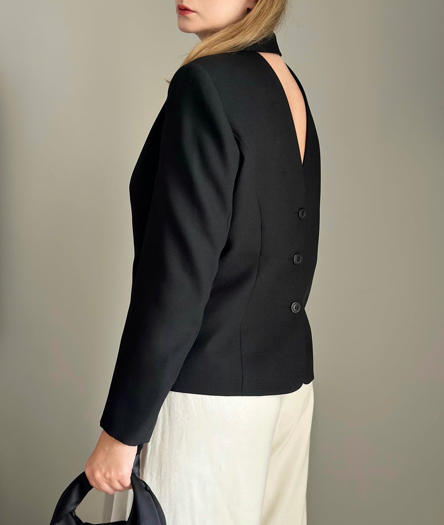 Striking vintage black blazer with open back