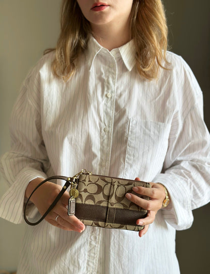 Iconic vintage brown Coach wristlet