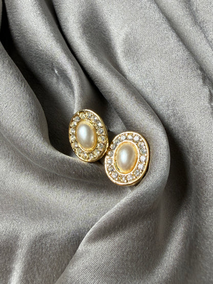 Classic vintage stud earrings featuring a faux pearl