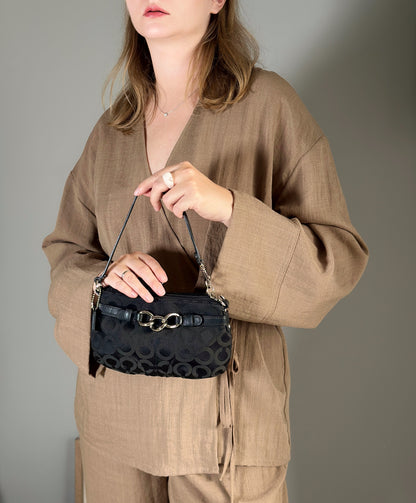 Timeless vintage authentic Coach wristlet bag