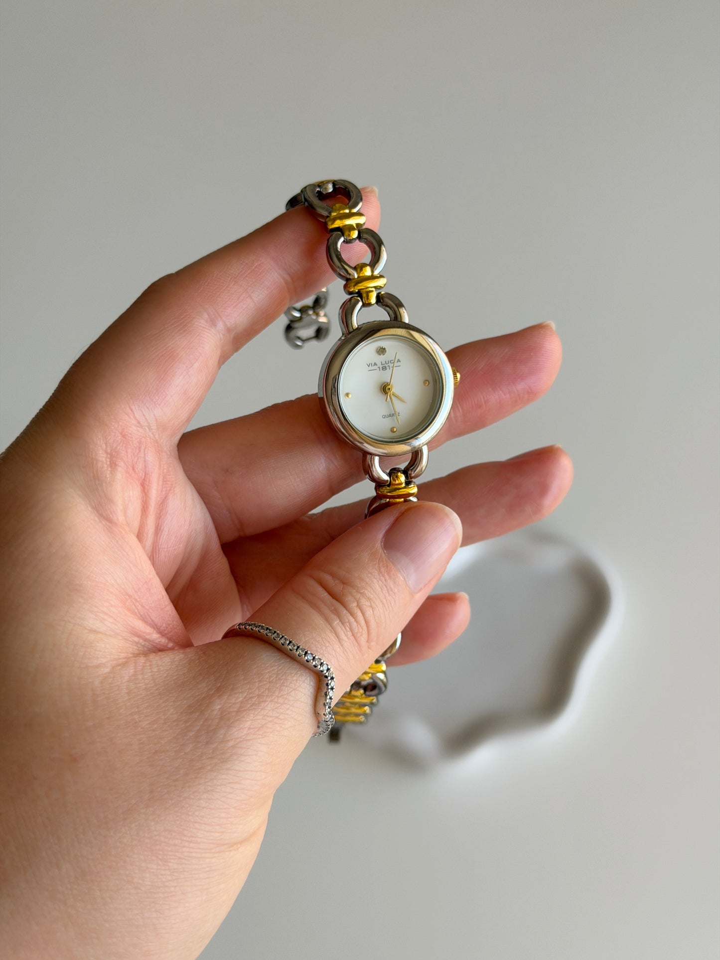Vintage two-tone watch with a delicate round dial